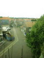 Zicht op de Kerkstraat met rechts vooraan de pastorie van de Jodocuskerk.